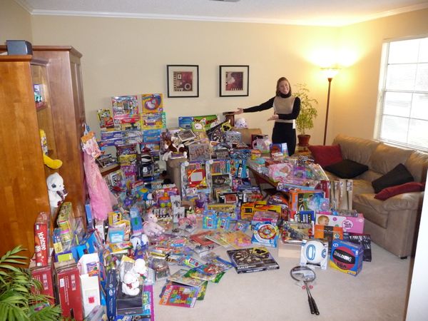 Kelly Hunt, REALTOR® in Living Room with Toys Collected