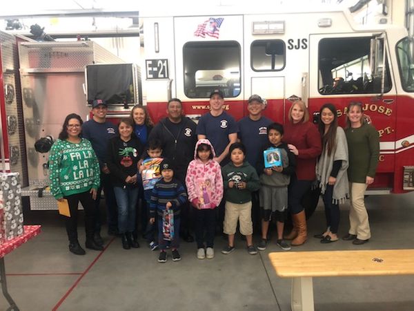 Children with Firemen in front of fire truck